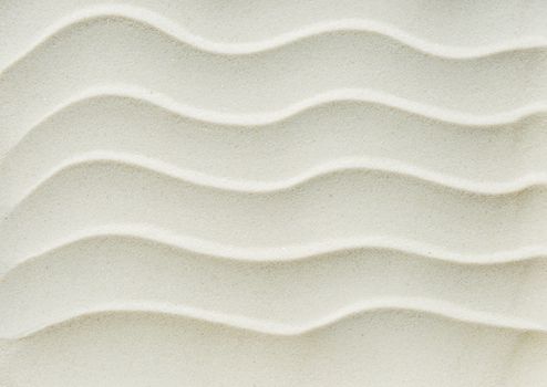 Beautiful white background of fine clean sand with waves