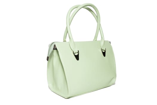 The photograph shows a female handbag on a white background