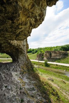 View from inside the Cave in toltre near the Busteni village, Glodeni district, Moldova. Toltrels are the name given to the limestone rock from the coral reefs in the sea, wich covered these lands hundreds of million years ago. Caves were used as houses by the pre-historic population.