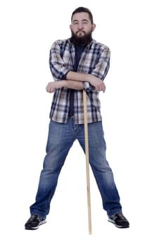 Bearded young farmer in a plaid shirt with a stick on a white background