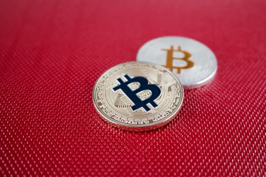 Digital currency physical gold and silver bitcoin on the red background