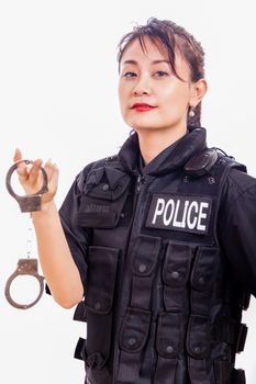 Chinese female police officer holding handcuffs