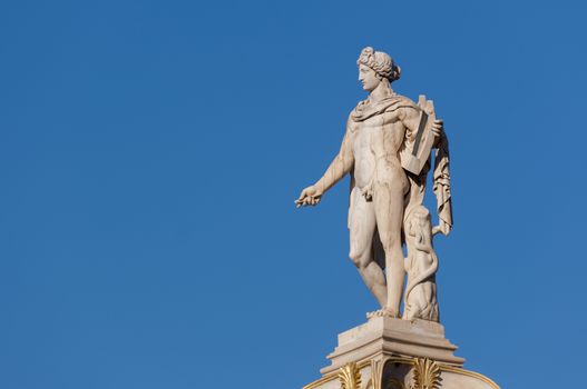 classical Apollo god statue from side