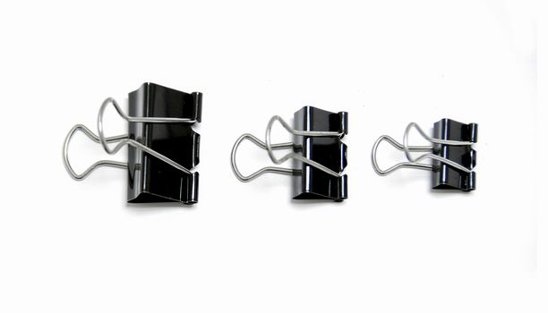 three size black clips on white background
