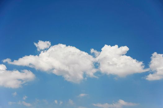 white clouds with blue sky on bright day