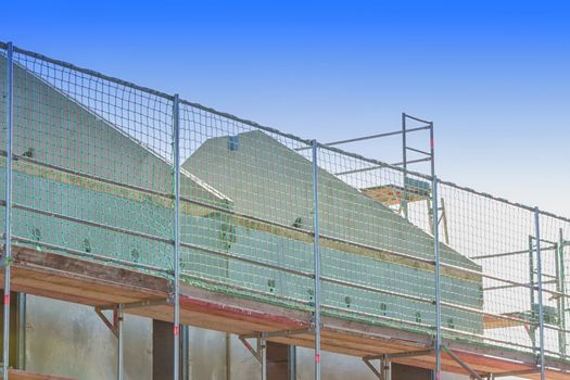 The construction of a settlement with turnkey prefabricated houses.
Prefabricated house under construction
