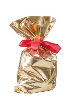 Golden Christmas gift bag with a red bow isolated on a white background