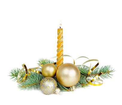 Christmas composition with a burning candle, fir branches, Christmas balls and golden serpentine, isolated on a white background