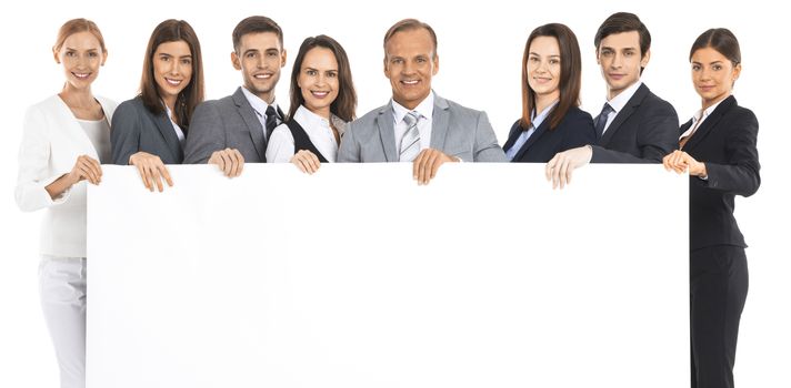 Full length portrait of business team holding blank billboard isolated on white background