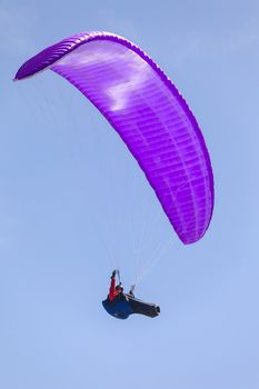 This is an image of a paraglider over Muscle Beach along California’s central coast.  Muscle beach is located in Pacifica, California, which is a prime spot for paragliding due to its fantastic weather conditions and views. 