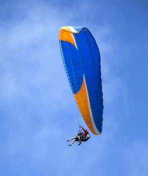 This is an image of a paraglider over Muscle Beach along California’s central coast.  Muscle beach is located in Pacifica, California, which is a prime spot for paragliding due to its fantastic weather conditions and views. 