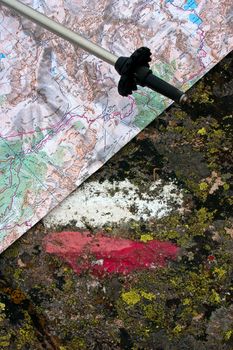 Red White Walking Trail Sign with Hiking Stick and Map