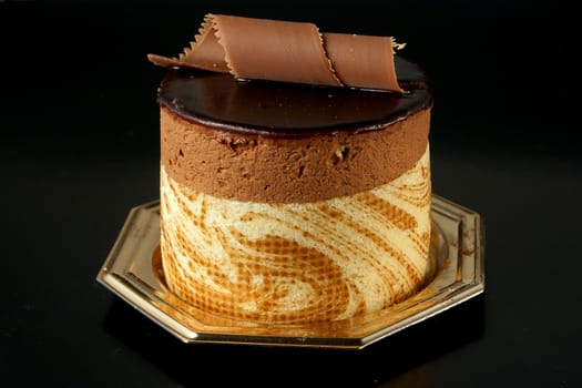 Tasteful Chocolate Pastry mousse isolated on black background