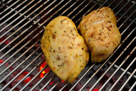 Cooking tastetful meat on a barbecue outside in the garden