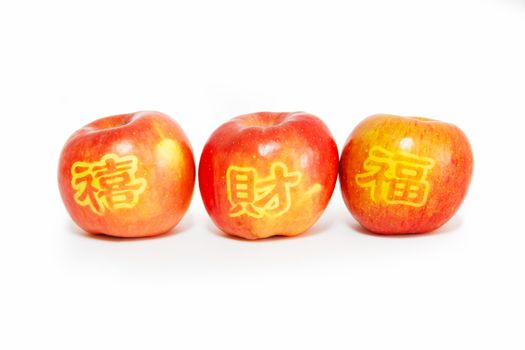 red apples with carving stamp of Happiness, blessing and wealth word, Chinese language