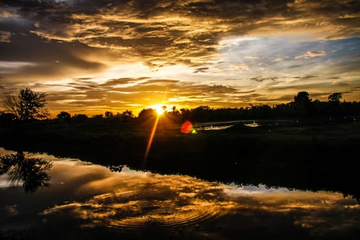 orange sky reflect on canal in evening