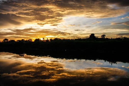 orange sky reflect on canal in evening