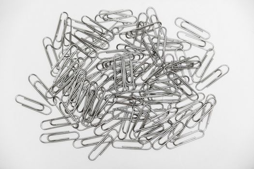 many metal stainless clips on white background