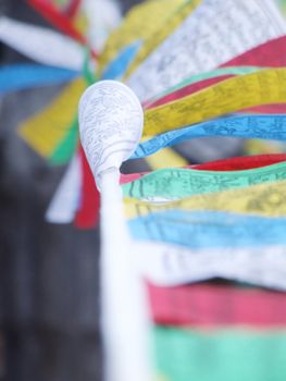 Colorful Tibetan Buddhism prayer flags - selective focus