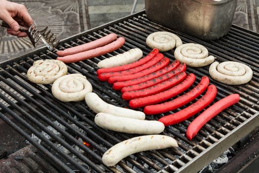 Closeup shot of the sausages on a grill