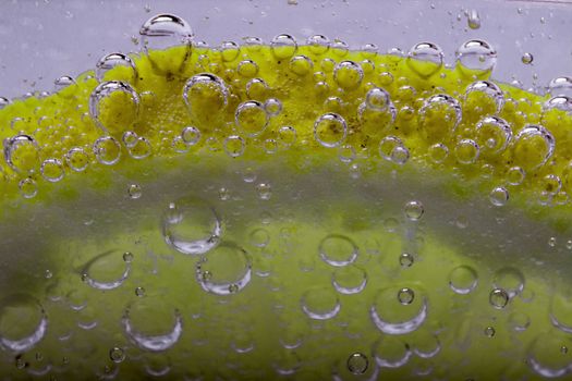 Slice Of Lemon In Mineral Water Bubbles 