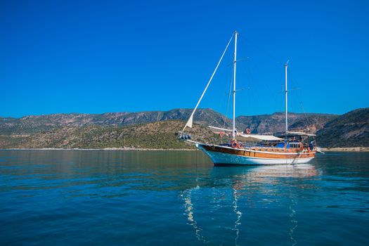 yacht on bay and castle in Kekova, near ruins of the ancient city on the Kekova island, Turkey