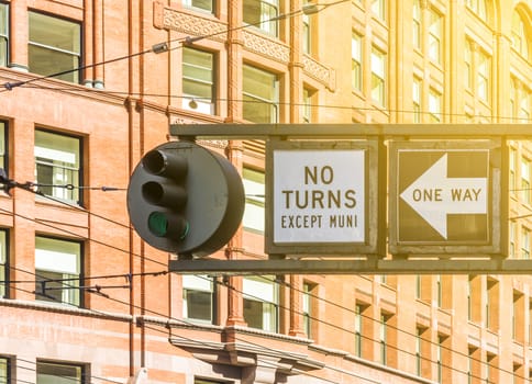 Traffic Light and No Turning except MUNI  in backlight Cables Wires building