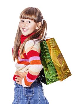 Smiling six years Girl holding presents bags isolated