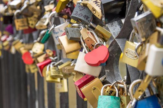 Locks and Keys on Charles Bridge in Prague, blank red lock in focus

