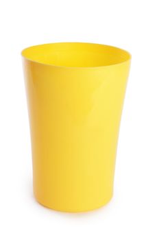 Plastic yellow cups isolated on white background