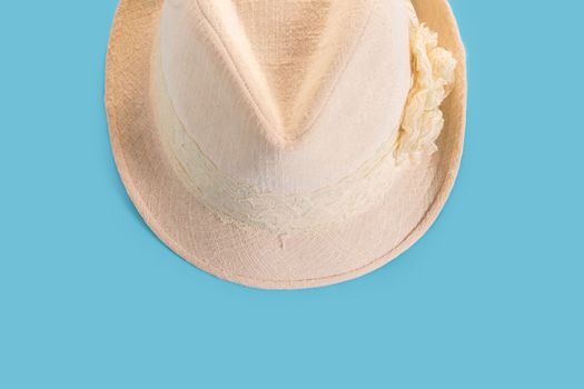 Summer woman's hat close-up on a blue background