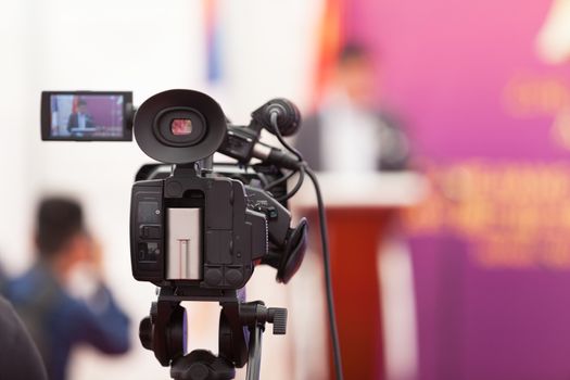 Video camera on news conference