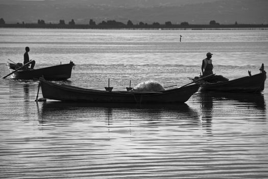 Sunset in the lagoon, where fishermen return to the approach of the impending storm. Dawning. Mediterranean islands.