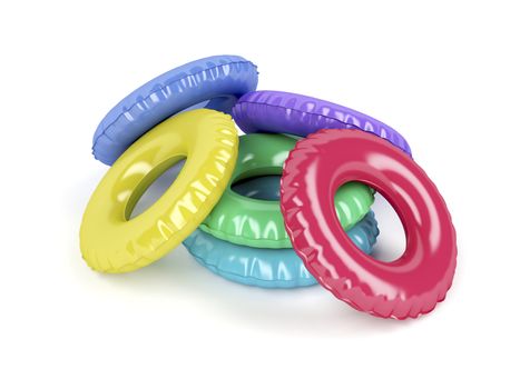 Swim rings with different colors on white background 