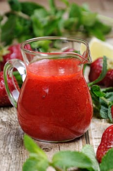 Strawberry fresh sauce with mint and lime. Vertical shot. Close-up.