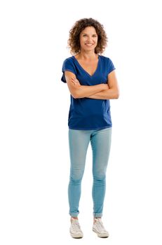 Smiling middle aged woman with arms folded, isolated on white background