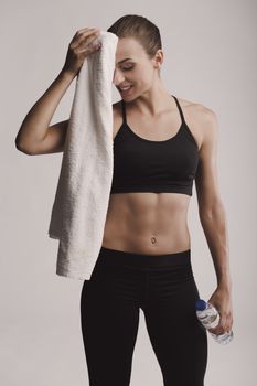 Portrait of sporty young woman tired after a gym workout