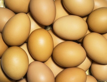 Stack of fresh chicken eggs for background
