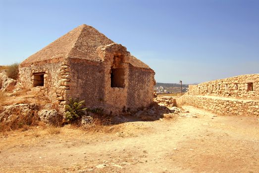 wall and house in Firka fortress at sun day, Crete.