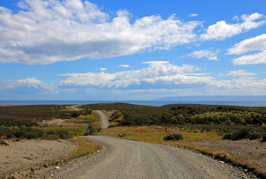 Gravel road trough landscape in Tierra del Fuego, Patagonia, Chile