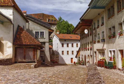 Houses and street in Gruyeres village by day, Fribourg, Switzerland