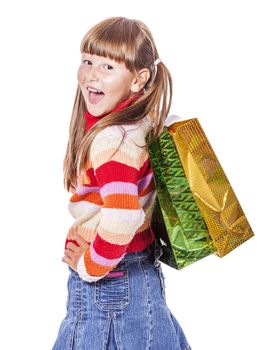 Smiling six years Girl holding presents bags isolated