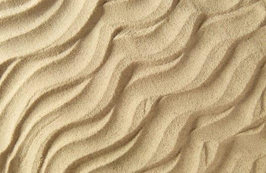 Textured beach sand ridges close up