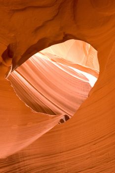 Rock window carved within Antelope Canyon, a slot canyon near Page, Arizona on land owned by the Navajo Indians