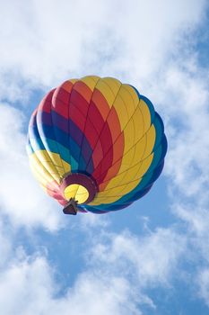 Hot air balloon flying in the clouds