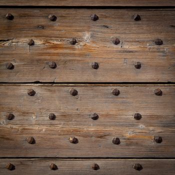 Detail of a 200 years old Italian door, made of wood.  Background use.