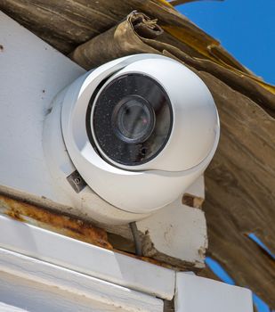 Security CCTV camera under blue sky