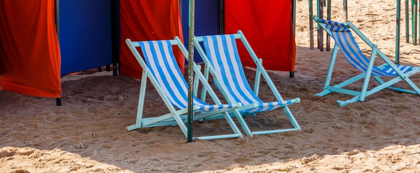 Empty deckchairs on a beach