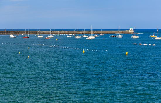 Saint jean de Luz bay with luxurious boats on a sea