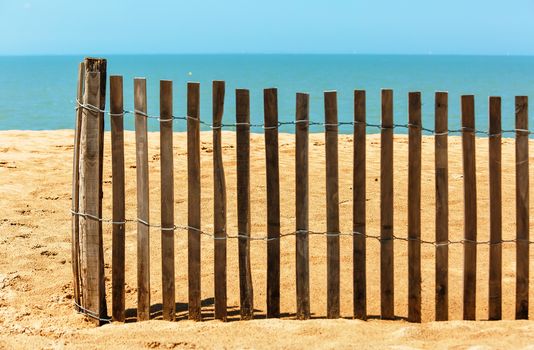 Palisades on sand beach near ocean. Private beach concept